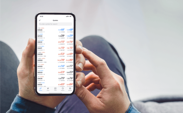 Trader using MetaTrader 4 on a computer, analyzing Forex charts with a modern trading workspace setup.